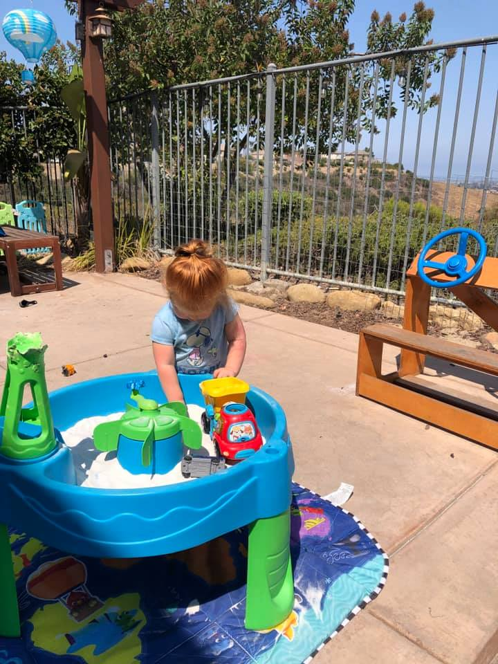 Child enjoying sensory play at the water table